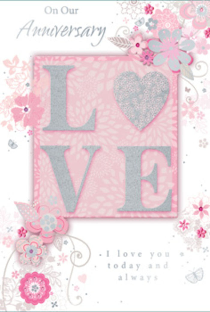 The image shows an anniversary card that opens like a small doorway into a sunlit, romantic space, the sort you might discover in a tucked-away Notting Hill café on a peaceful afternoon. Dominating the front is the word LOVE, printed in tall, confident letters and finished with frosted glitter that creates a soft, ice-crystal sparkle. The texture is raised and pleasantly grainy under the fingertips, inviting touch, as if to make the sentiment tangible. These letters rest against a smooth blush-pink block that feels almost velvety to the eye, set on a paler pink background that allows every decorative element to stand out with clarity. Floating around the central word is a ring of wispy, hand-drawn flowers and fine sprays of foliage, their shades of blush, lilac, and warm ivory blending in a way that brings to mind a thoughtfully curated bouquet ready for delivery to a home just off Ladbroke Grove. The blooms are not heavy or overly detailed; instead, they appear like soft sketches, lightly shaded and traced with delicate lines that curl and loop, similar to filigree. Tiny leaves, swirling stems, and almost-hidden butterflies flutter along the edges, suggesting the quiet flutter in your chest when you pause to remember how far your love has come. The inner message, I love you today and always, orients itself in a graceful, understated typeface, with each word spaced so it feels like a gentle, spoken promise. Overall, the card evokes the feeling of a hand-tied bouquet in paper form-romantic yet calm, perfectly suited to accompany a fresh floral delivery in W11 to celebrate an anniversary with sincerity and heartfelt devotion.